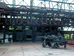 Open-hearth furnace (built in 1950), operating site (2003), Prudenko’s charging machine, 1891-built shop (front). Open-hearth exposition, works museum